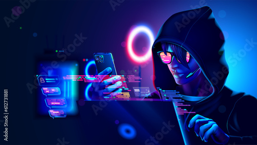 Hacker or phone scammer in hood hacking at computer and mobile smartphone in dark room. Computer criminal uses malware on phone to hack devices. Hacker in dark hoodie in room with neon light using pc