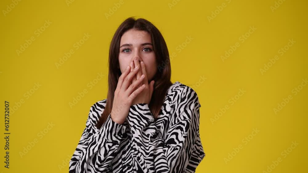 4k video of one girl with negative facial expression over yellow background. 4k video of one girl with negative facial expression over yellow background.