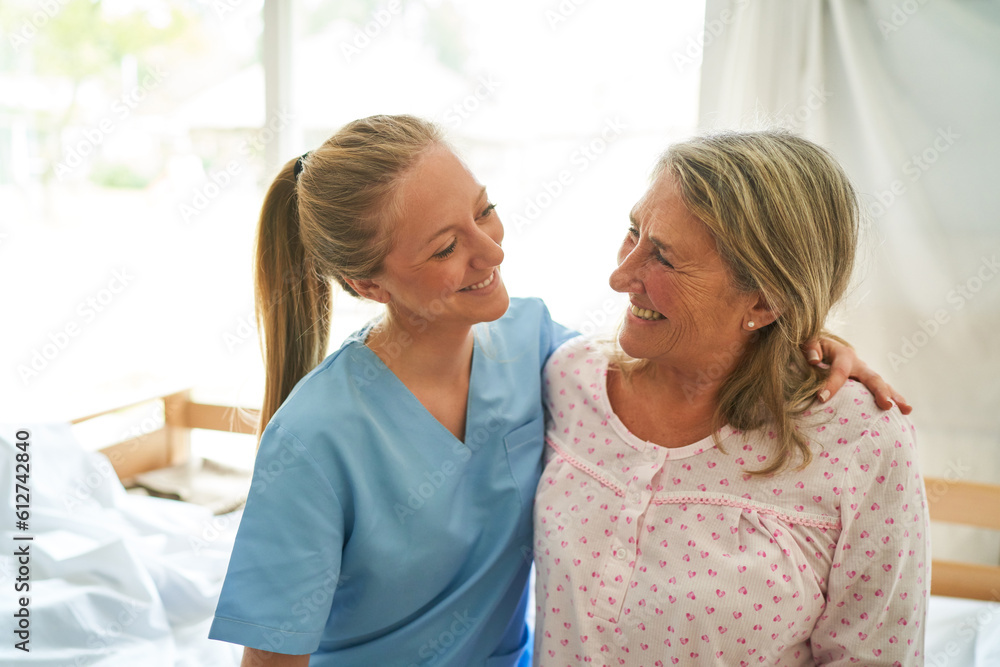 Happy caregiver with elderly woman at rehab center Happy caregiver with elderly woman at rehab center