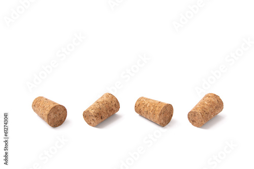 Isolated group of four corks on white background. Wine symbol.
