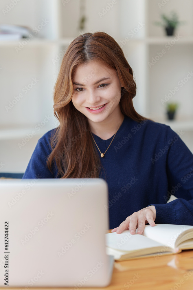 Beautiful young Asian woman college student at classroom. College student working on the college campus. back to school concept Beautiful young Asian woman college student at classroom. College student working on the college campus. back to school concept