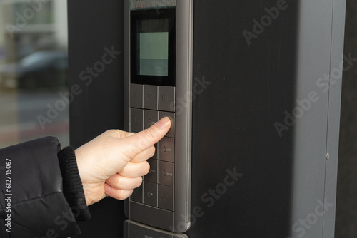 Secure Home System, Hand Pressing on Intercom Keypad, Using Door Phone, Doorphone, Entryphone, Videophone Call