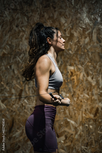 Obraz na płótnie woman jumping rope at crossfit gymnasium w salonie