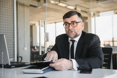 Angry boss shouting at his employee