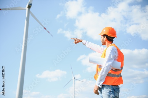 Indian Windmill engineer inspection and progress check wind turbine. © Serhii