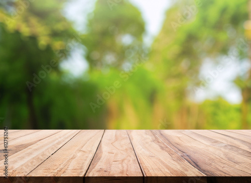 Garden Table. Wooden Background with Green Plants, Trees and Leaves in Bokeh Blur for Product Display