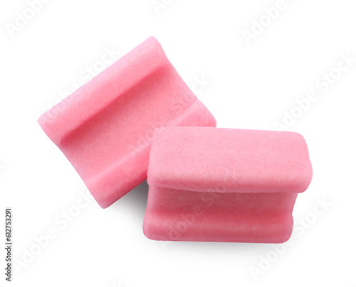 Tasty pink chewing gums on white background, top view