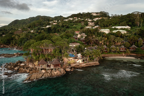 Tropical aerial landscape, luxury villas with amazing sea and lagoon beach, tropical nature