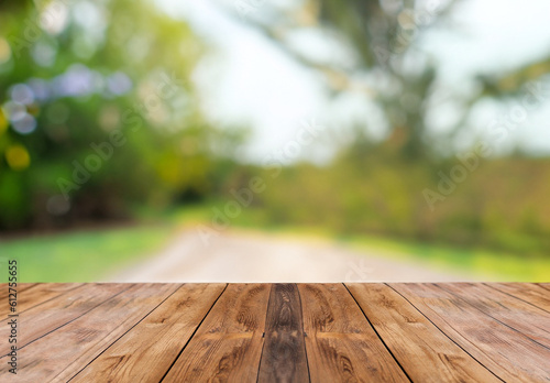 Garden Table. Wooden Background with Green Plants  Trees and Leaves in Bokeh Blur for Product Display