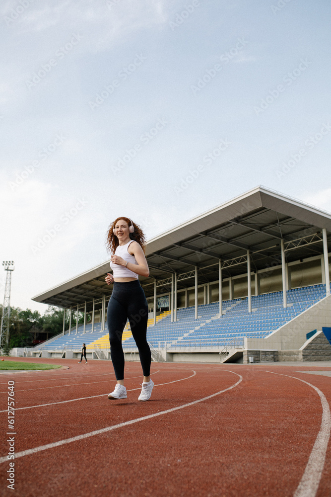 woman running on track