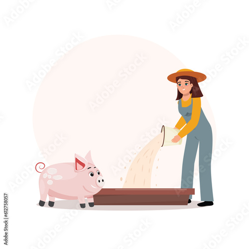Farm worker feeding a cute pig at the long trough.
