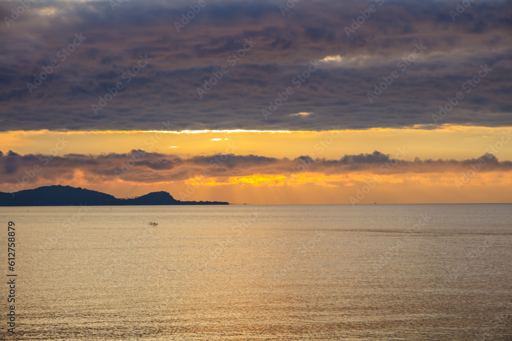 Morning sea orange light. Meditation ocean and sky background.