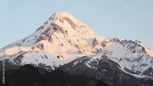 Great Caucasus mountains and ancient Gergeti Trinity Church in Kazbegi, Georgia