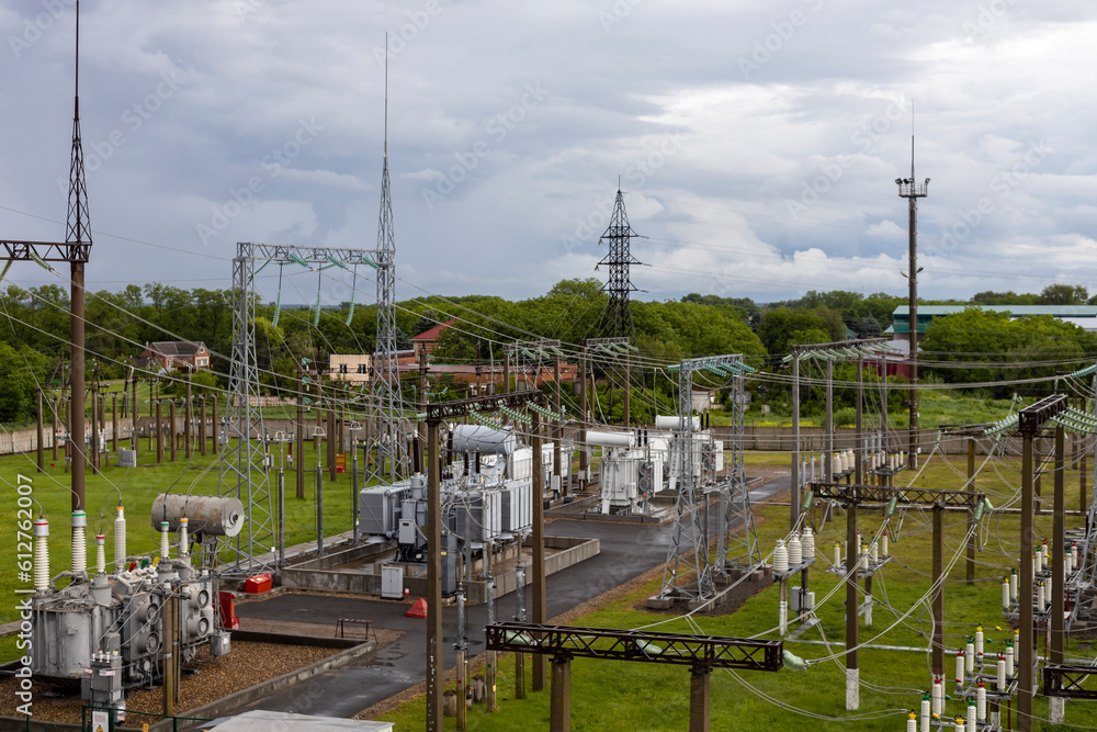 Top view of the electrical substation. Substation with transformers, insulators and switches distributing high voltage. Top view of the electrical substation. Substation with transformers, insulators and switches distributing high voltage.