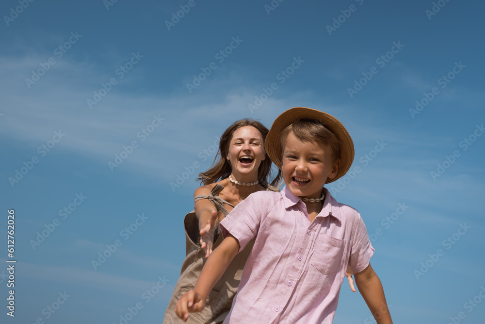 Mother and son having fun together outdoors in summer Mother and son having fun together outdoors in summer