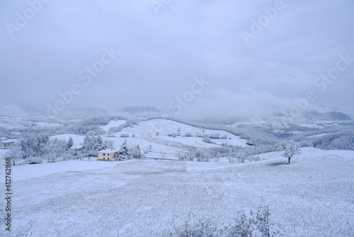 Blizzard in the mountains. Snowy hills, mountains, village, nature, horizon. Natural background. Appennino-Tosco-emiliano   © Kate
