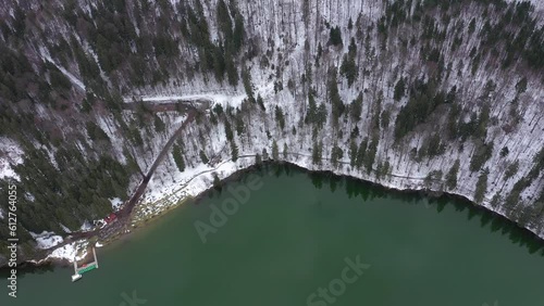 Aerial Drone View of a Volcanic Crater Lake at Winter. Flying Above Sfantu Ana Lake, Szent Anna Lake, Szeklerland, Transylvania, Romania photo