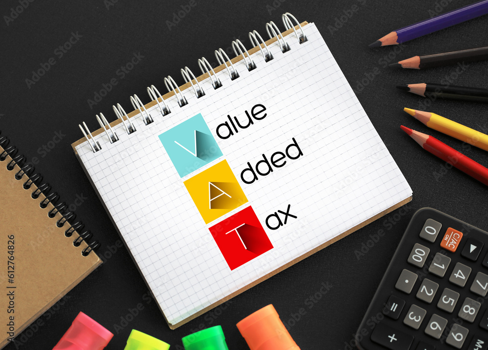 VAT - Value Added Tax acronym on notepad, business concept background VAT - Value Added Tax acronym on notepad, business concept background
