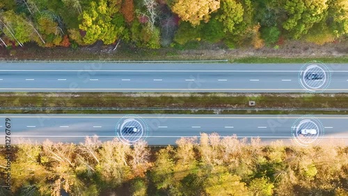 Aerial view of autonomous cars driving on american highway with fast moving autopilot traffic. Future of interstate transportation concept