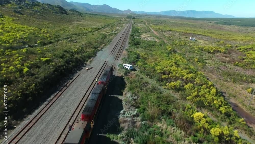 Drone, transport and supply chain train with cargo for transportation industry on a track in a nature landscape. Container, logistics and vehicle for international freight export on a railway Drone, transport and supply chain train with cargo for transportation industry on a track in a nature landscape. Container, logistics and vehicle for international freight export on a railway