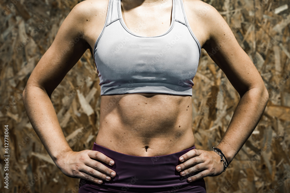 Woman posing with bare midriff.