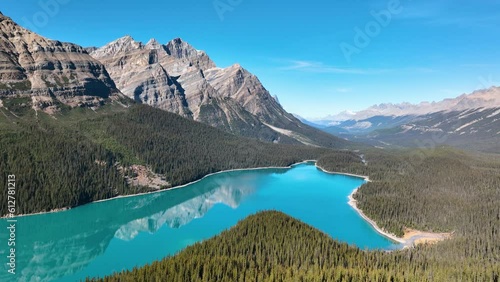 Lake Peyto, Banff National Park, Alberta, Canada. A huge panorama of Landscape during daylight hours. A lake in a river valley. Mountains and forest. Natural landscape. photo