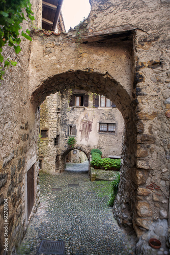 Via Fratelli Bandiera  a narrow lane through tunnel arches  Canale di Tenno  Trentino-Alto Adige  Italy.  Tenno is  included in the list of the most beautiful villages in Italy