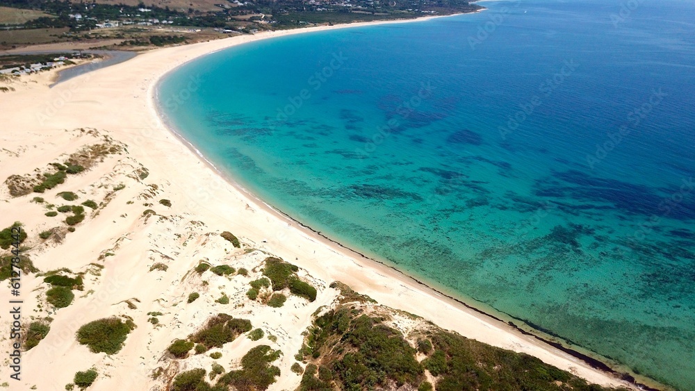 Obraz premium beautiful aerial view from the dunes from Valdevaqueros and a bay with turquoise blue water of the Atlantic Ocean, ,Tarifa, Andalusia, province of Cádiz, Spain, Travel, Tourism