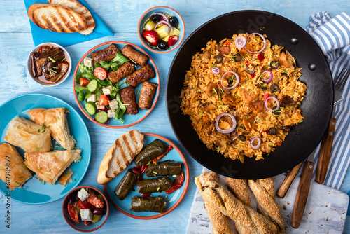 Traditional greek food on a blue wooden background.Flat lay