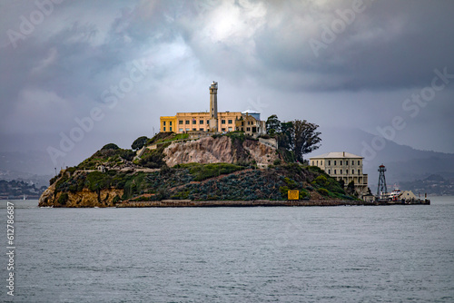 The federal prison of Alcatraz on its island in the middle of San Francisco Bay in California, USA under a cloudy sky. Prison of the United States of America of maximum security. Prison concept.