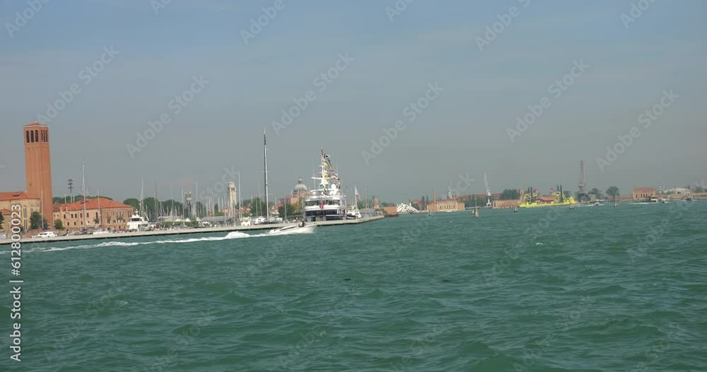 View of the Francesco Morosini Naval Military School on the Sant'Elena island and ships. Venetian lagoon, Venice, Italy.