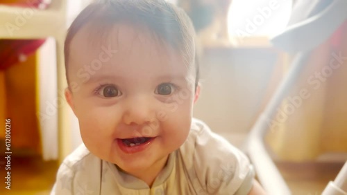 baby newborn playing at the window at home. happy family child dream concept. baby smiling indoors. small child baby playing lifestyle