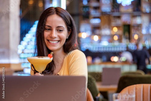 Beautiful  woman using laptop at cafe