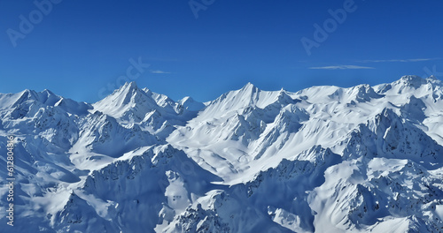 Mountains covered with White snow,and blue sky panoramic.Generative AI illustration © ZS 