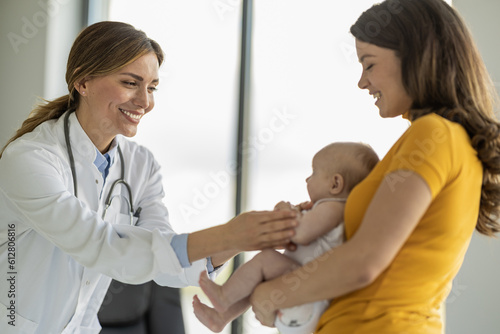 Doctor pediatrician and baby patient in clinic