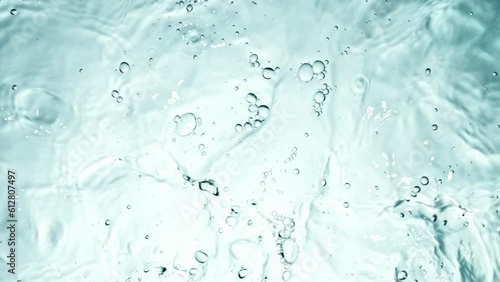 Clear water surface texture with splashes and bubbles.
