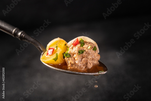 Spoon with meatballs soup, romanian traditional cuisine - Ciorba de perisoare.