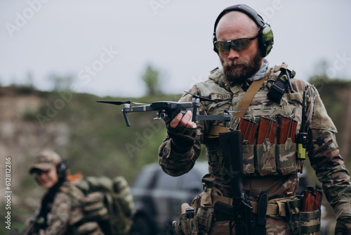 Portrait of Ukrainian military man holding a drone
