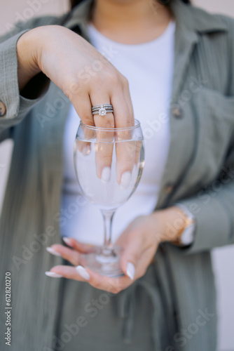 person holding glass. content for the manicurist. humor. trends. 