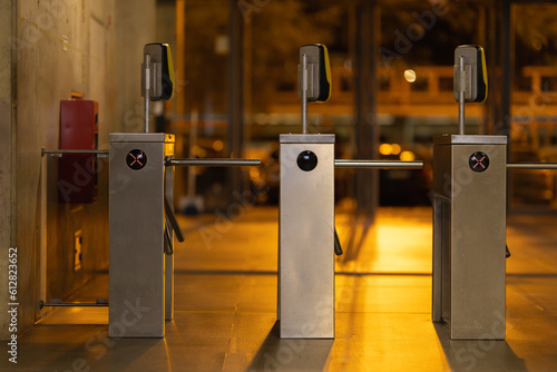 Access turnstiles from the subway in the late evening
