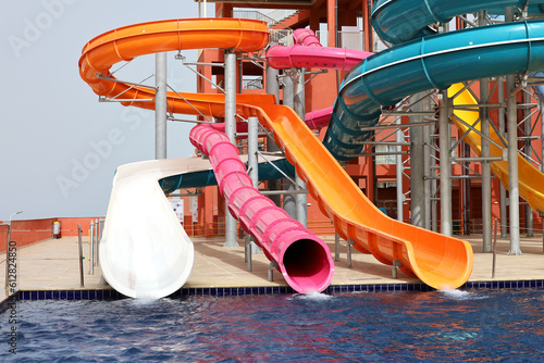 Fototapeta Naklejka Na Ścianę i Meble -  Water slides and swimming pool in aqua park. Amusement park on tourist resort