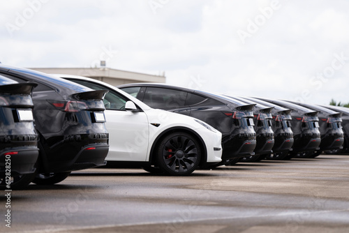Electric vehicles awaiting preparation for sale