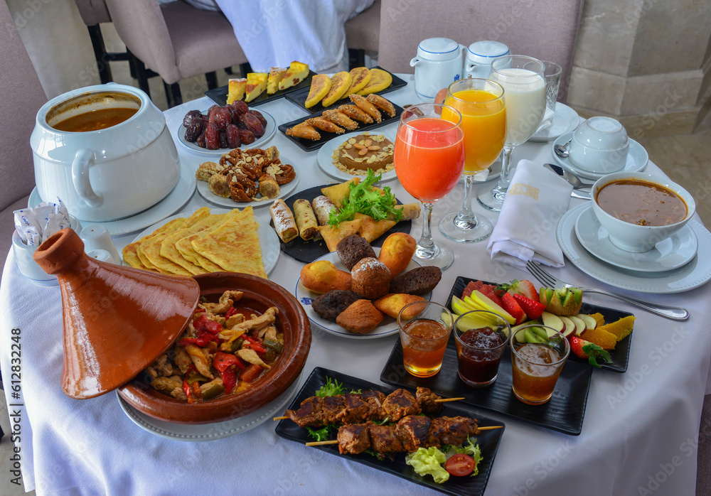 Moroccan breakfast in Ramadan. Harira soup. Dates, tea, juices and various sweets Moroccan breakfast in Ramadan. Harira soup. Dates, tea, juices and various sweets