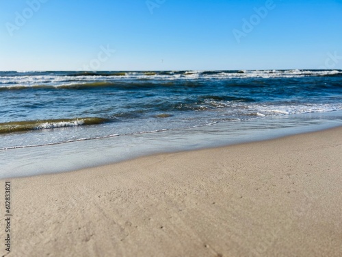 Blue seascape  waves on the sea  sandy coastline  empty beach