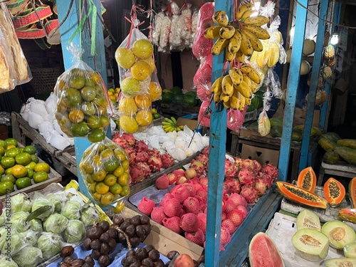 Fruit store on the street selling many kinds of assorted fresh fruit  © FaizZakiy