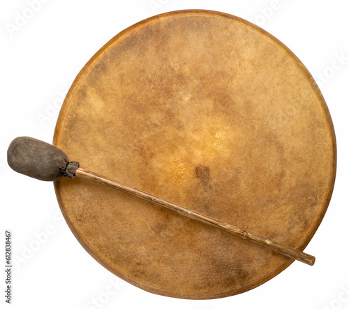 handmade, native American style, shaman frame drum covered by goat skin with a beater isolated on white