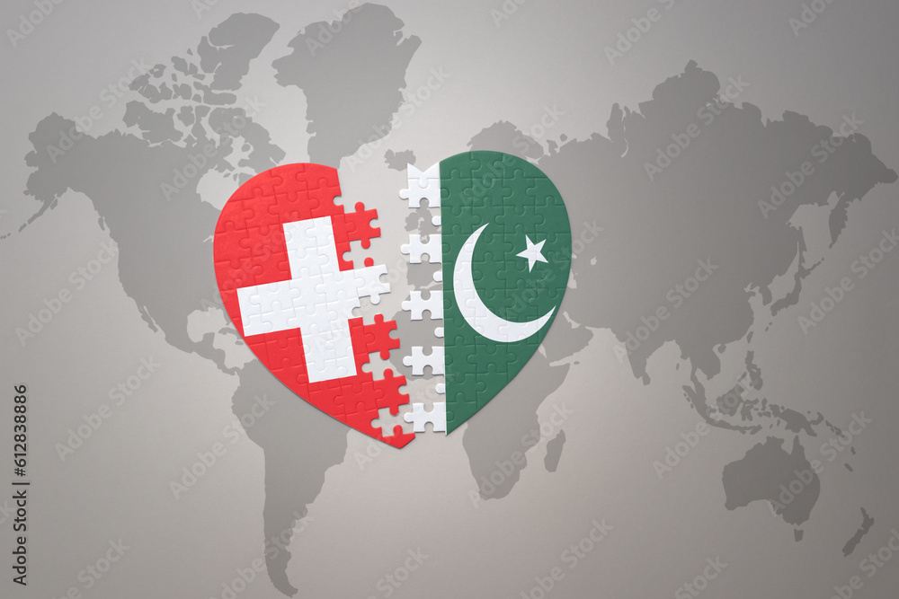 puzzle heart with the national flag of pakistan and switzerland on a ...
