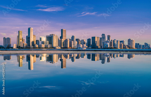 city skyline sunrise new miami Florida skyscrapers reflection water sea beautiful 