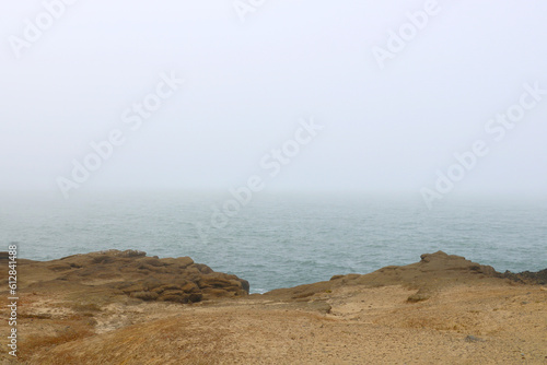 View of a foggy morning on the shores of the Pacific Ocean.