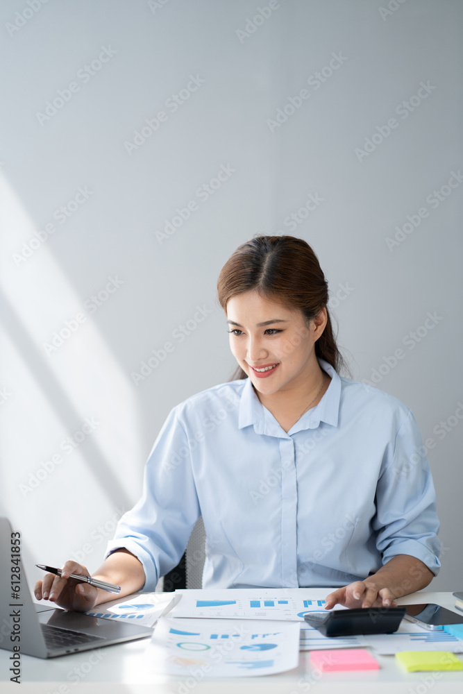 Young smart Asian businesswoman working with laptop computer, preparing for the next meeting. Young smart Asian businesswoman working with laptop computer, preparing for the next meeting.